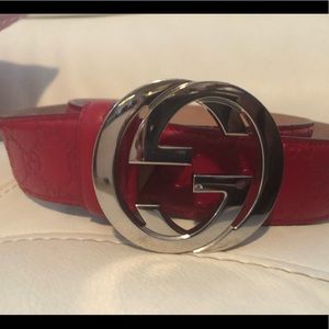 Red embossed Gucci belt
